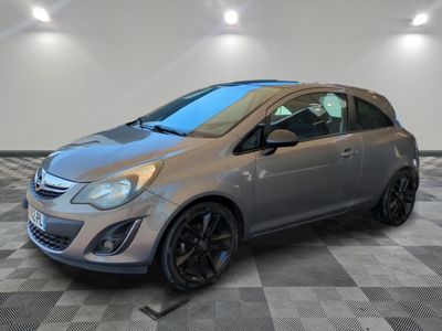 a silver car parked in a room with a checkered floor