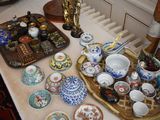 a table that has many different plates and bowls on it