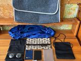 many items that are sitting on a wooden bench