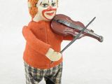 un clown jouant du violon sur un fond blanc
