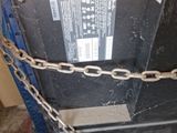 a large metal box with a chain around it
