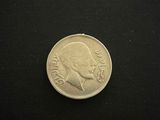 a coin that is sitting on a black surface