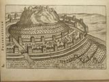 an old book with a drawing of a castle on top of a hill