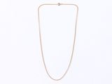 a gold chain necklace with a diamond clasp on a white background