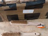 two wooden brushes and a box on the floor