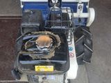 a small motorcycle with a basket on the back of it