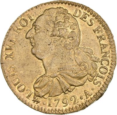a gold coin with an image of a man ' s head on it