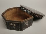 a small wooden box with a floral design on it