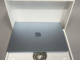 an open box with a laptop inside of it on a table