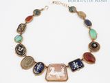 an image of a necklace with a picture of a woman and a horse on it