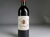 a bottle of wine that is sitting on a table