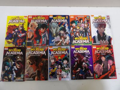 beaucoup de livres d'anime sur la table