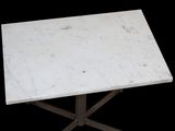 white marble table with cross legs on a black background