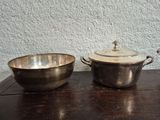 two bowls and a saucer sitting on a table