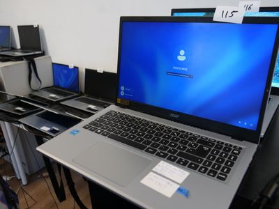 a laptop that is sitting on a desk in front of a monitor