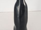 a black object that is sitting on a white surface