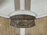 a white purse with a silver buckle on it