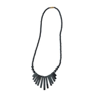 a black beaded necklace with black beads on a white background