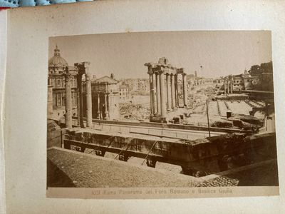 an old picture of a train on the tracks in the city