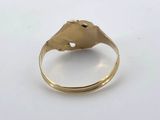 a close up of a gold ring with a horse ' s head on it