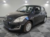 a picture of a small black car on a checkered floor