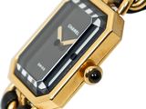 an image of a black and gold wrist watch with a chain around it