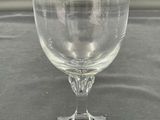 a wine glass sitting on top of a table