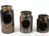 three jars that are sitting next to each other on a table