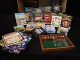 a box full of board games on a black table