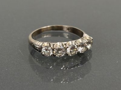 a close up of a diamond ring on a table