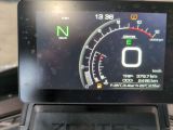a car dashboard with a digital speedometer on it