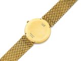 a close up of a gold watch on a white background