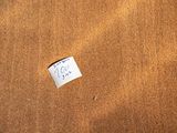 a piece of paper on the floor of a room