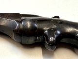 an old gun that is on display on a table