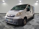 a white van parked in a room with checkered flooring
