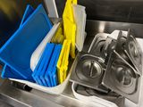 a picture of a kitchen sink filled with dishes and utensils