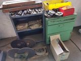 a green cabinet with tools on it next to a yellow box