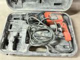 two tools in a case that are sitting on a table