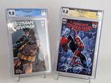 batman and spider - man comic books on display on a table