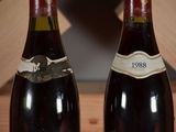 two bottles of wine that are sitting on a table