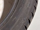 a close up of a tire on a white surface