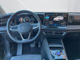 the interior of a car with a steering wheel, dashboard, and display screen