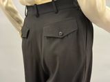 a close up of a person wearing a yellow shirt and black pants