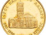 an image of a close up of a gold coin with a building on it