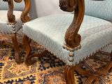 pair of carved wood chairs with blue upholstered upholstered upholstered upholstered upholstered upholstered upholstered