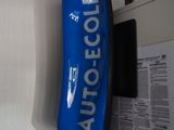 a blue sign on the wall that says autocolle