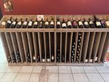 many bottles of wine on display in a wine shop
