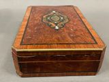 an old wooden box with a decorative design on the inside