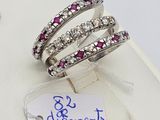 three bands of pink and white diamonds are displayed on a white surface