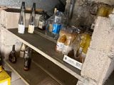 many bottles and jars on the shelves in the kitchen